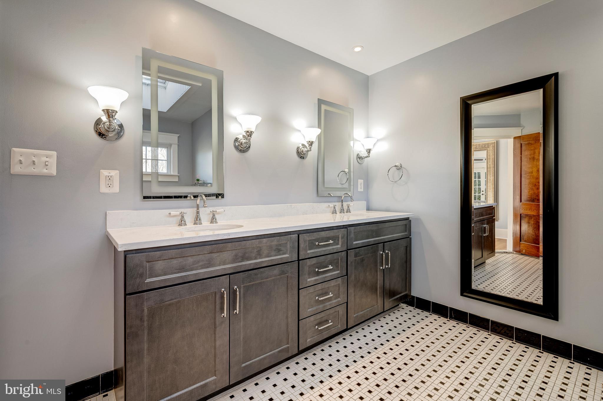 19209 Croom Road Brandywine, MD 20613 - Photo 34 of 95 a bathroom with a sink a vanity and a mirror