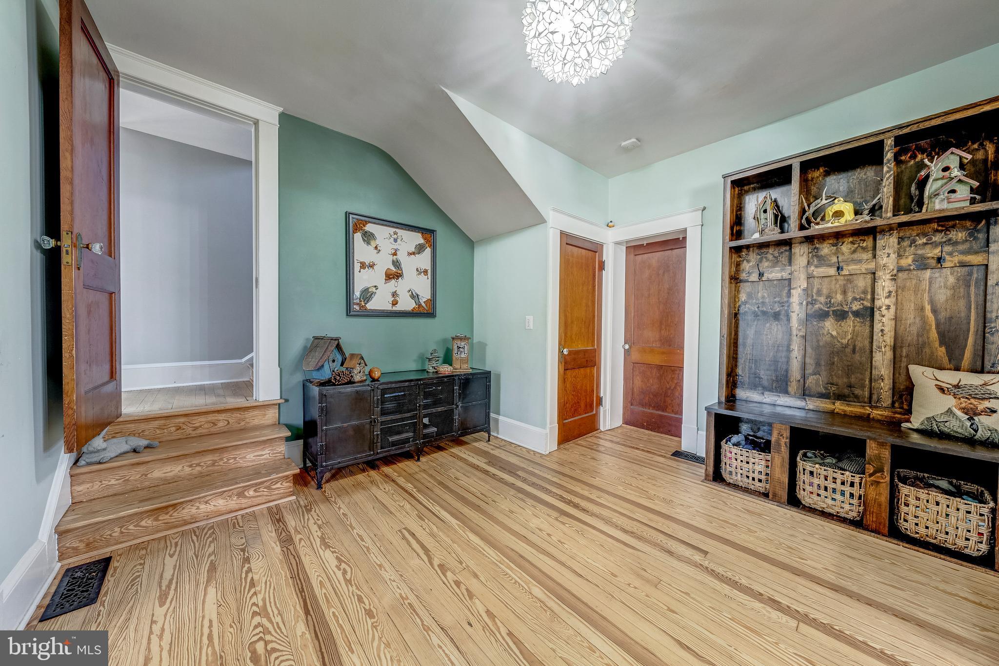 19209 Croom Road Brandywine, MD 20613 - Photo 38 of 95 a living room with furniture and a wooden floor