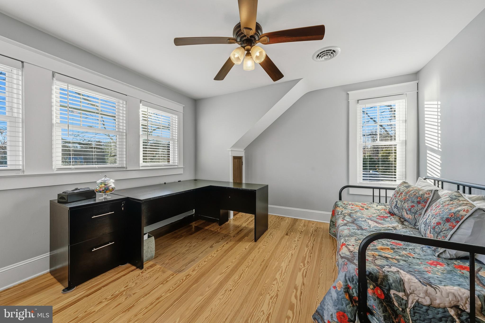 19209 Croom Road Brandywine, MD 20613 - Photo 41 of 95 a living room with furniture and a wooden floor