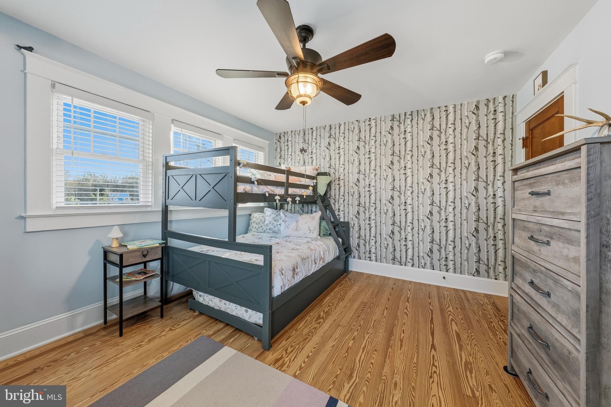 19209 Croom Road Brandywine, MD 20613 - Photo 42 of 95 a bedroom with a bed and a chandelier