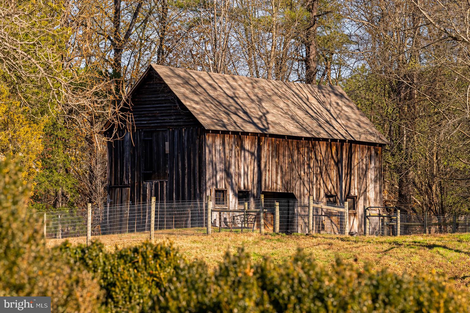 19209 Croom Road Brandywine, MD 20613 - Photo 62 of 95 a view of a house with a large window and wooden fence