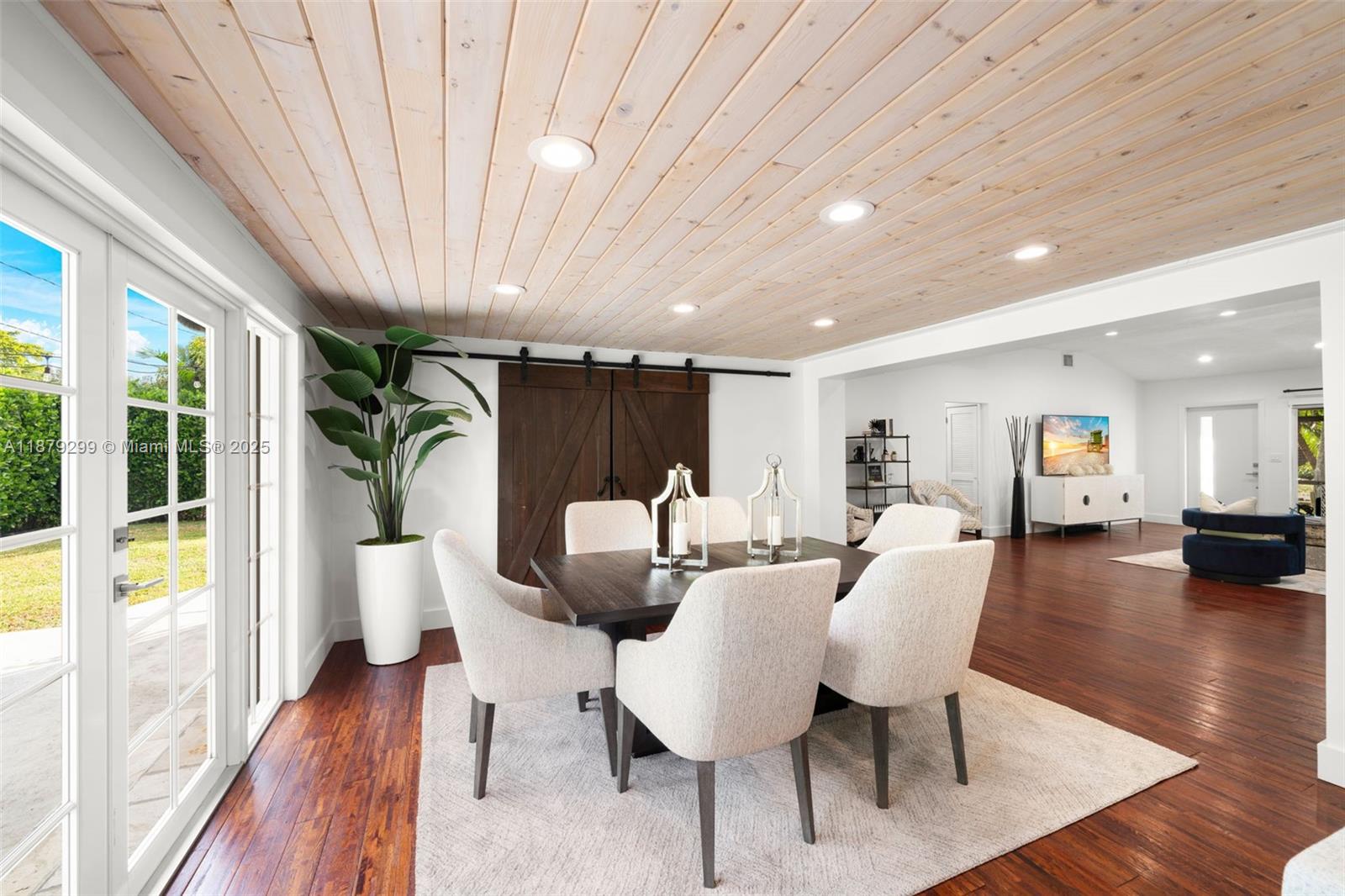 475 Northwest 88th Terrace El Portal, FL 33150 - Photo 12 of 33 a view of a dining room with furniture window and wooden floor
