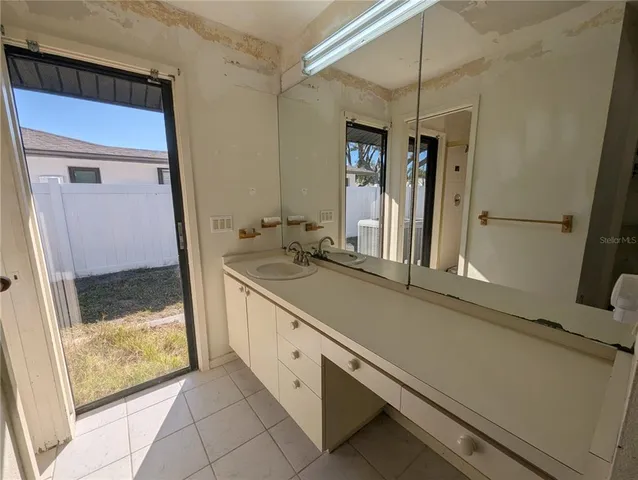 a bathroom with a glass door shower