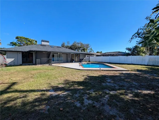 a house view with a backyard space