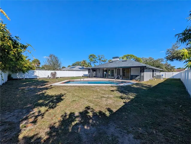 a view of a back yard of the house