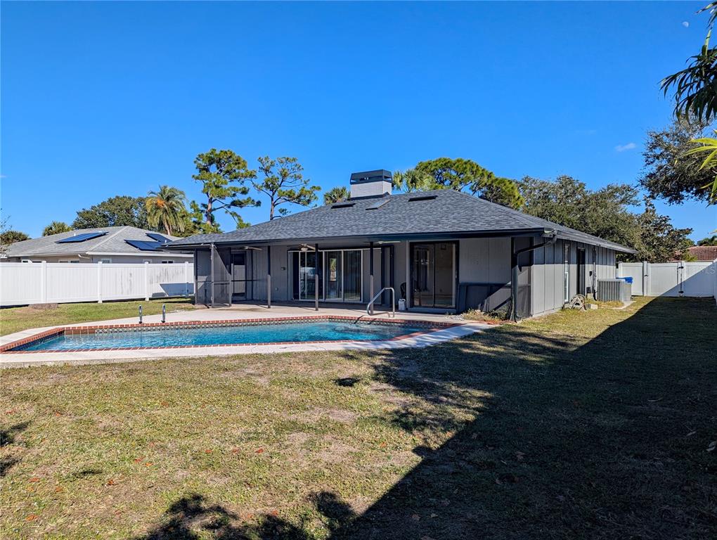1329 Pine Needle Road Venice, FL 34285 - Photo 30 of 43 a view of house with outdoor space and swimming pool