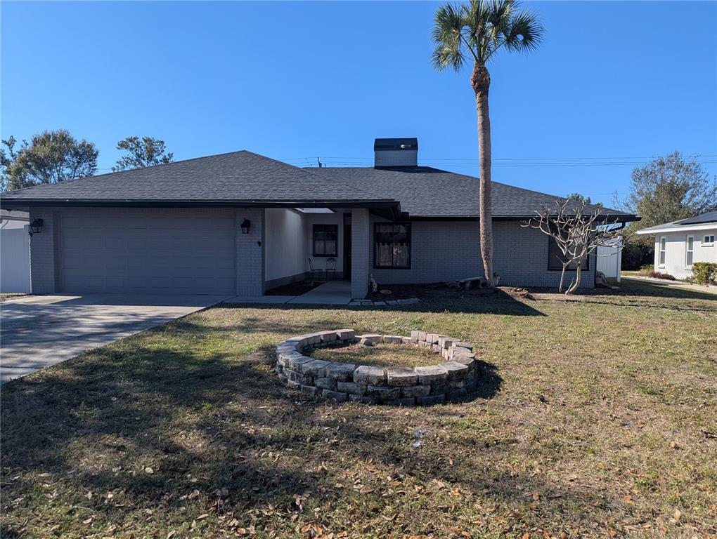 1329 Pine Needle Road Venice, FL 34285 - Photo 35 of 43 a front view of a house with a yard
