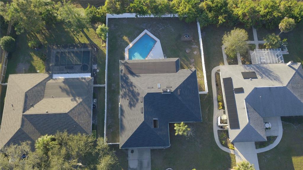 1329 Pine Needle Road Venice, FL 34285 - Photo 40 of 43 an aerial view of a house with pool and a yard