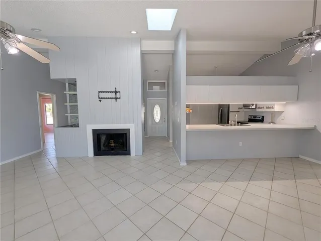 a kitchen with stainless steel appliances granite countertop a sink and a stove