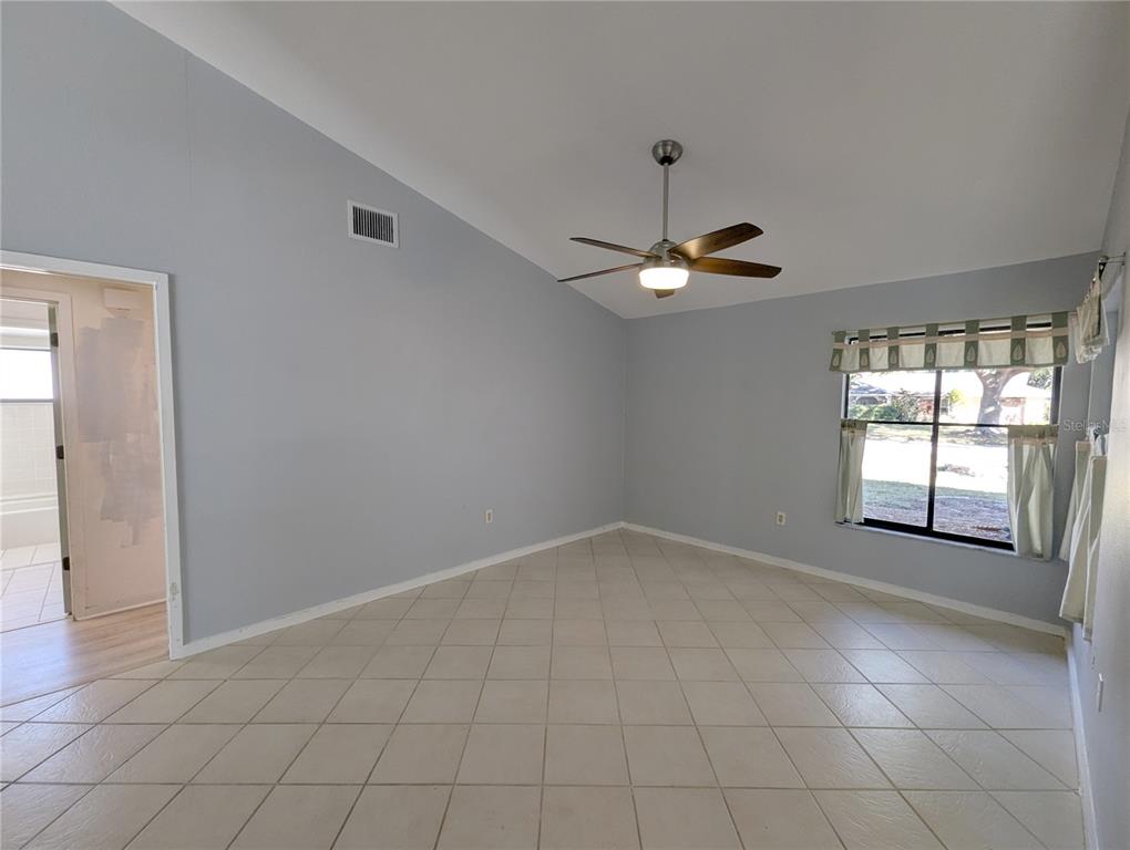 1329 Pine Needle Road Venice, FL 34285 - Photo 7 of 43 a view of an empty room with a window