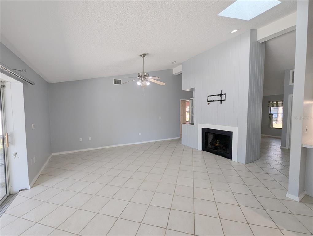 1329 Pine Needle Road Venice, FL 34285 - Photo 10 of 43 an empty room with fireplace