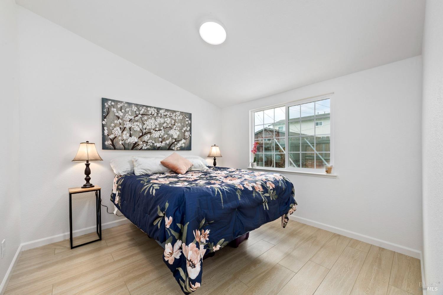 240 Rinaldo Drive Vallejo, CA 94589 - Photo 19 of 41 a bed sitting in a bedroom next to a window