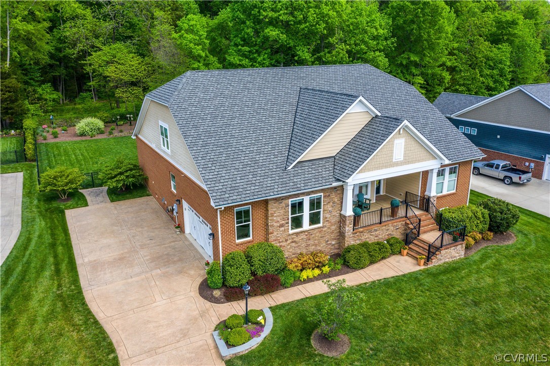 163 Button Bush Road Richmond, VA 23238 - Photo 1 of 46 a aerial view of a house with table and chairs in a yard