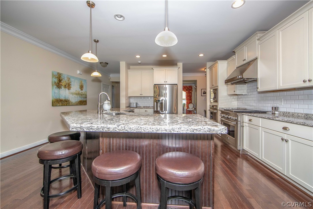 163 Button Bush Road Richmond, VA 23238 - Photo 11 of 46 a kitchen with a table chairs sink and cabinets