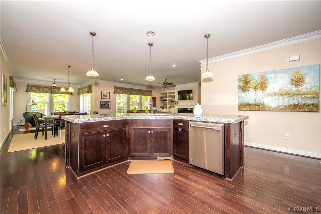 163 Button Bush Road Richmond, VA 23238 - Photo 12 of 46 a kitchen with stainless steel appliances granite countertop wooden floors and sink