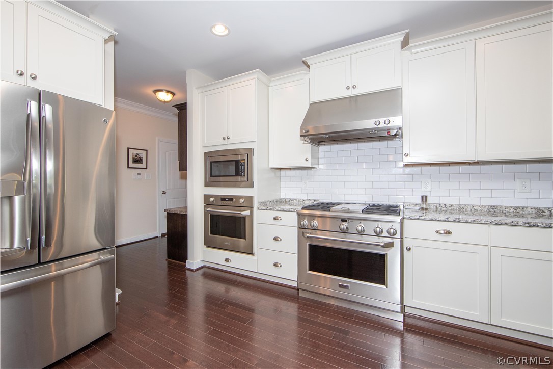 163 Button Bush Road Richmond, VA 23238 - Photo 13 of 46 a kitchen with stainless steel appliances a refrigerator stove and white cabinets