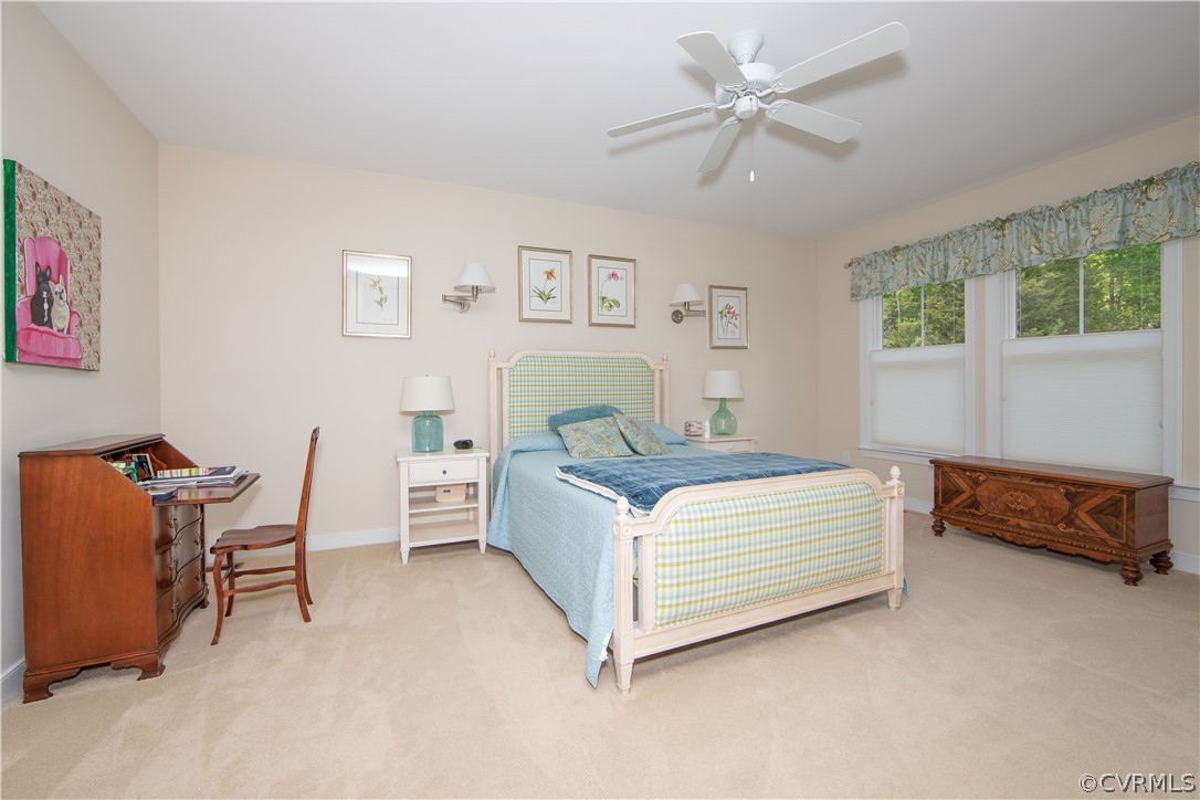 163 Button Bush Road Richmond, VA 23238 - Photo 16 of 46 a bedroom with a bed and a table in it
