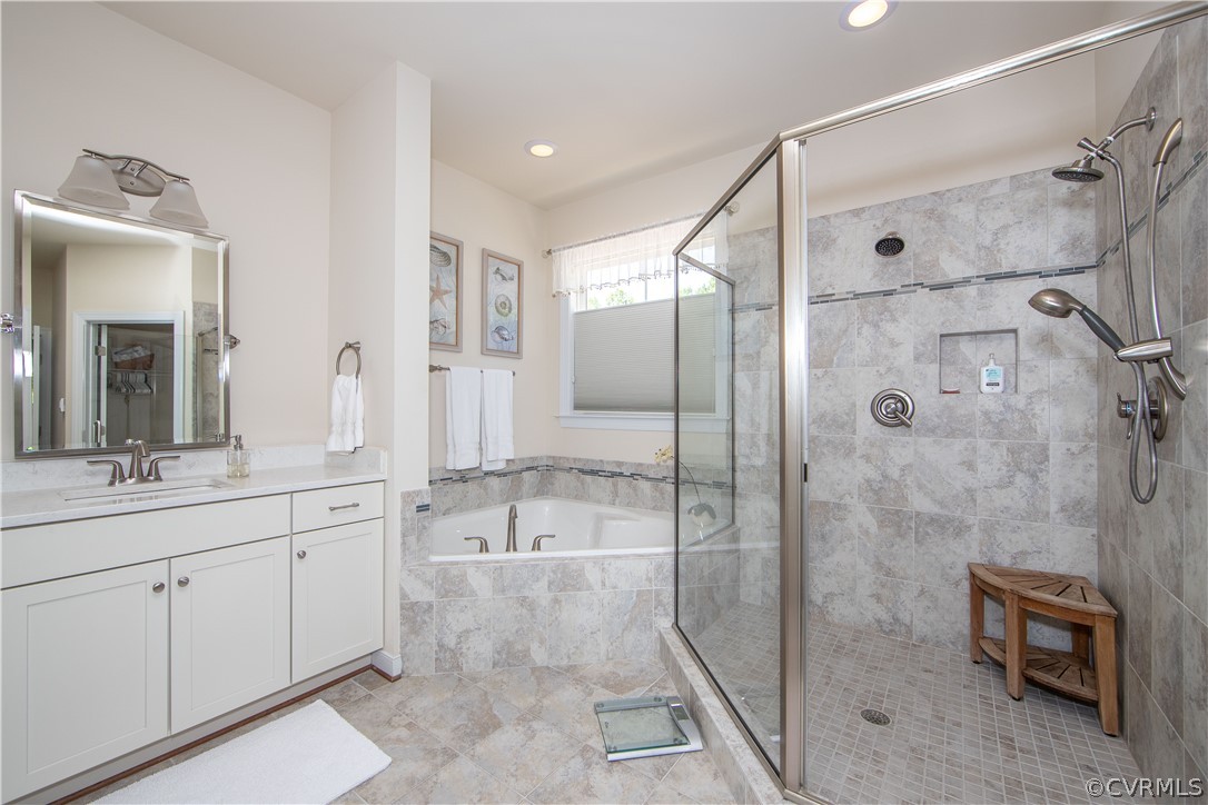 163 Button Bush Road Richmond, VA 23238 - Photo 20 of 46 a spacious bathroom with a granite countertop sink mirror and shower