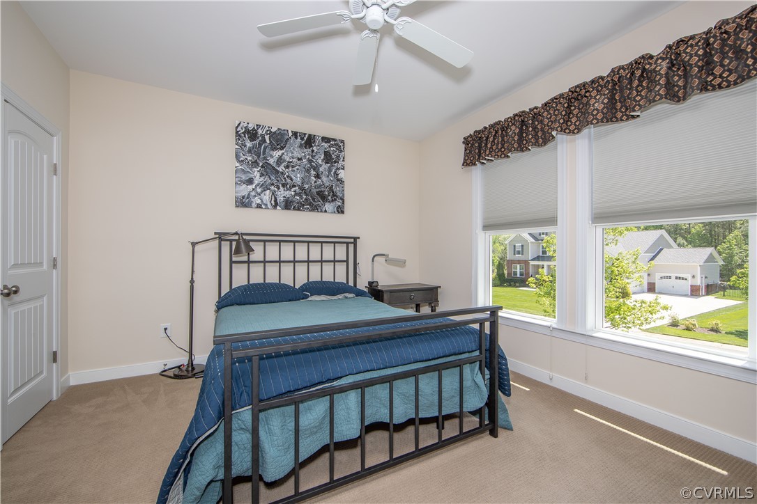 163 Button Bush Road Richmond, VA 23238 - Photo 32 of 46 a bedroom with a bed and a window