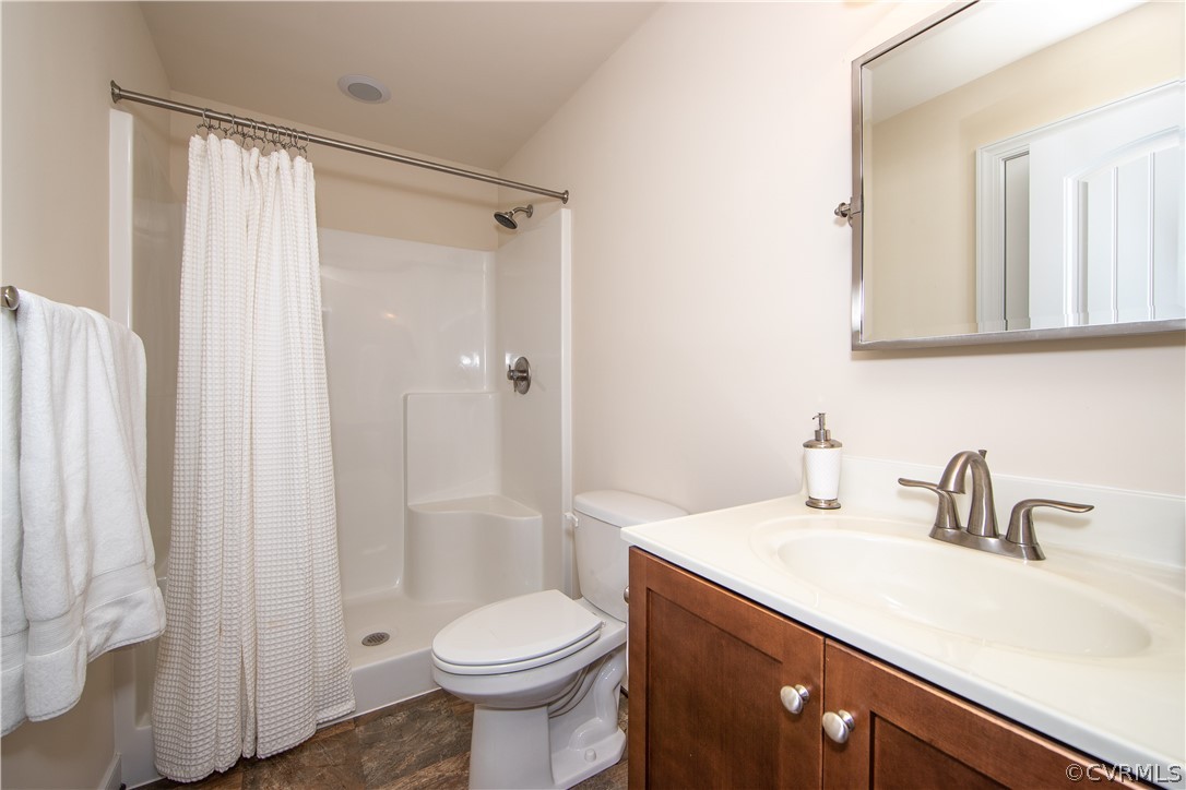 163 Button Bush Road Richmond, VA 23238 - Photo 35 of 46 a bathroom with a sink a toilet and shower