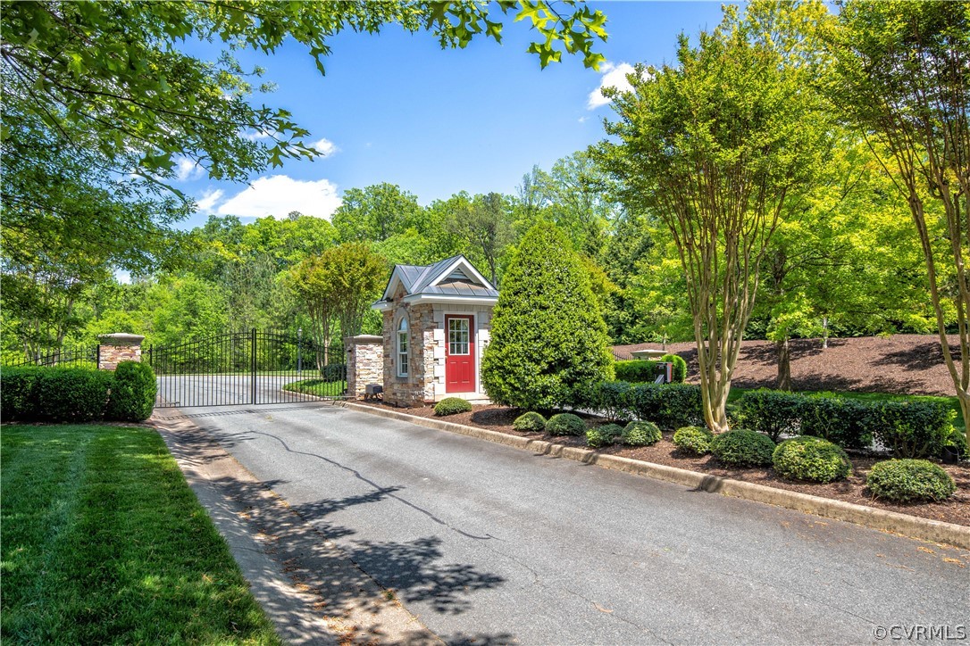 163 Button Bush Road Richmond, VA 23238 - Photo 38 of 46 a front view of a house with a yard and tree s