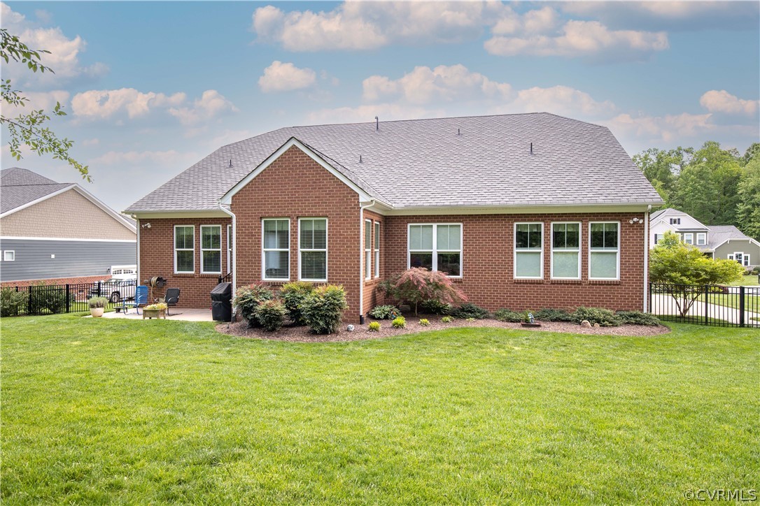 163 Button Bush Road Richmond, VA 23238 - Photo 42 of 46 a front view of a house with a garden and porch