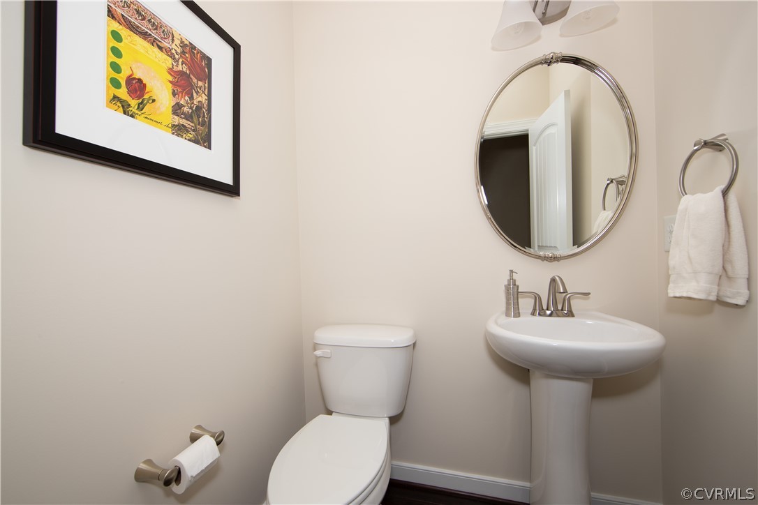 163 Button Bush Road Richmond, VA 23238 - Photo 7 of 46 a bathroom with a toilet sink and mirror