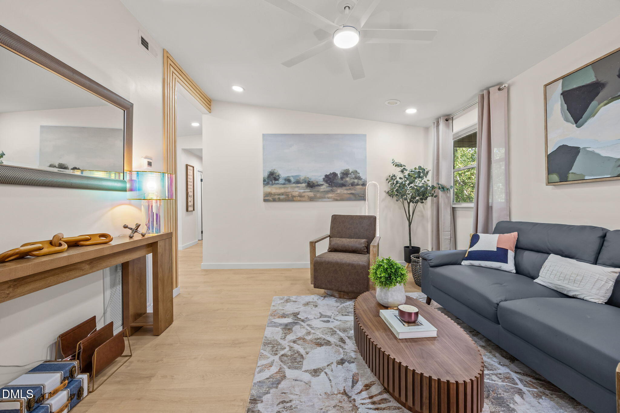851 Hadley Road Raleigh, NC 27610 - Photo 10 of 46 a living room with furniture and a fireplace