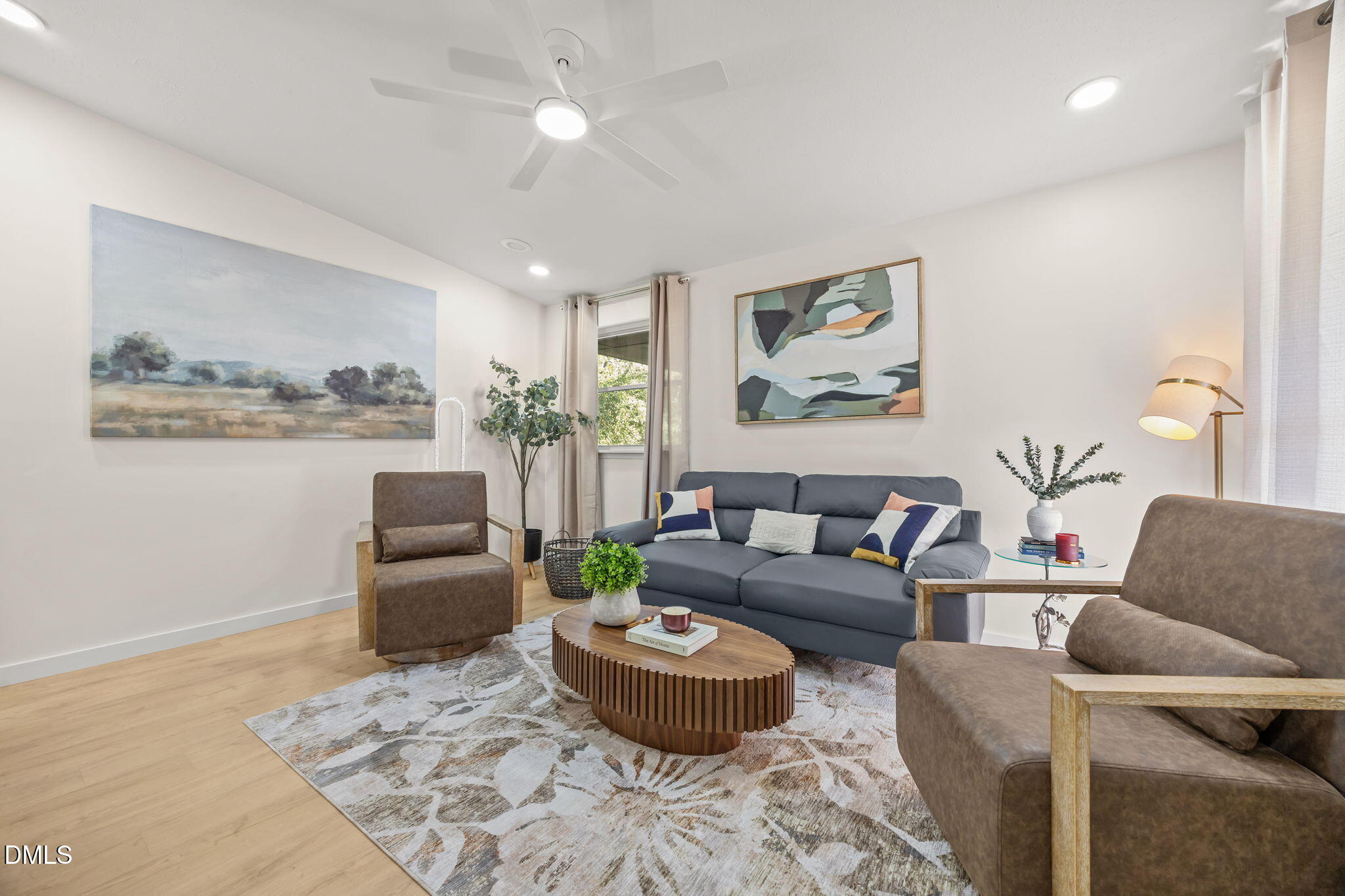 851 Hadley Road Raleigh, NC 27610 - Photo 12 of 46 a living room with furniture and a large window