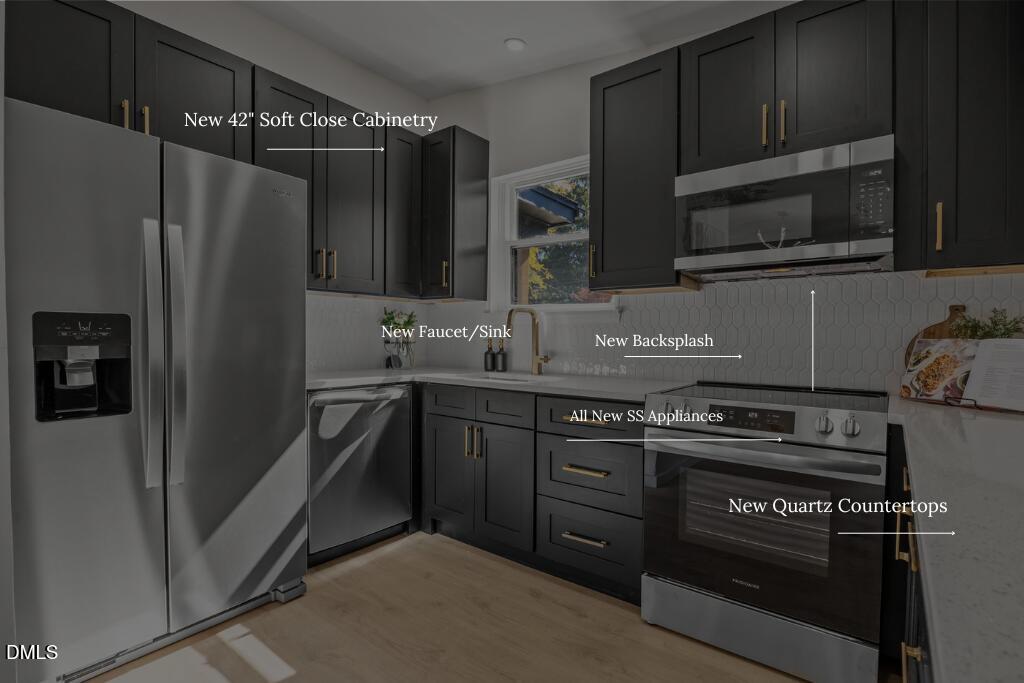 851 Hadley Road Raleigh, NC 27610 - Photo 18 of 46 a kitchen with granite countertop a refrigerator stove and microwave