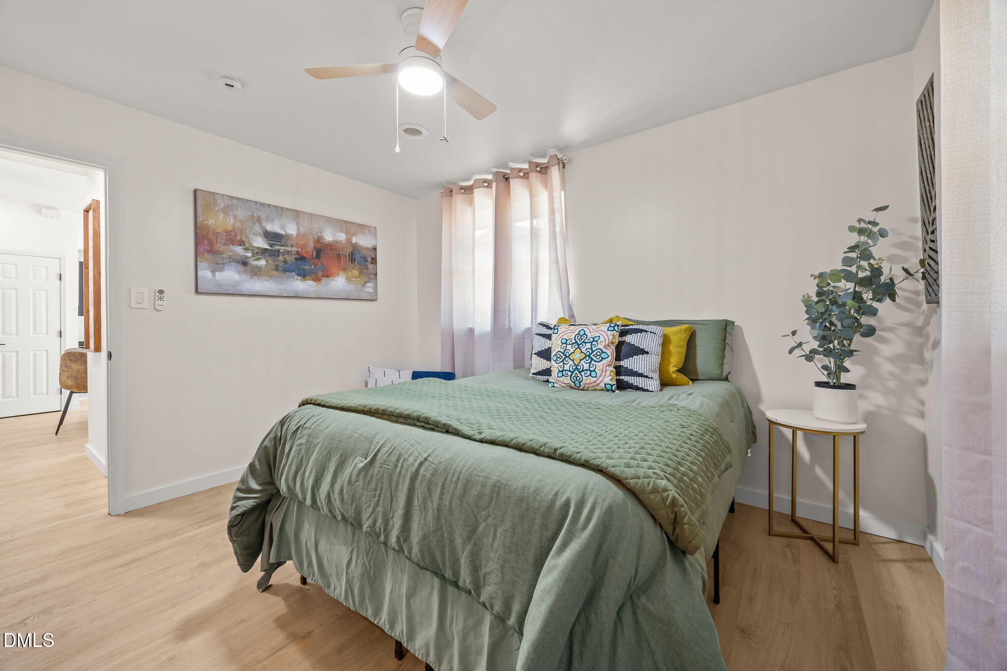 851 Hadley Road Raleigh, NC 27610 - Photo 31 of 46 a bedroom with a bed and a painting on the wall