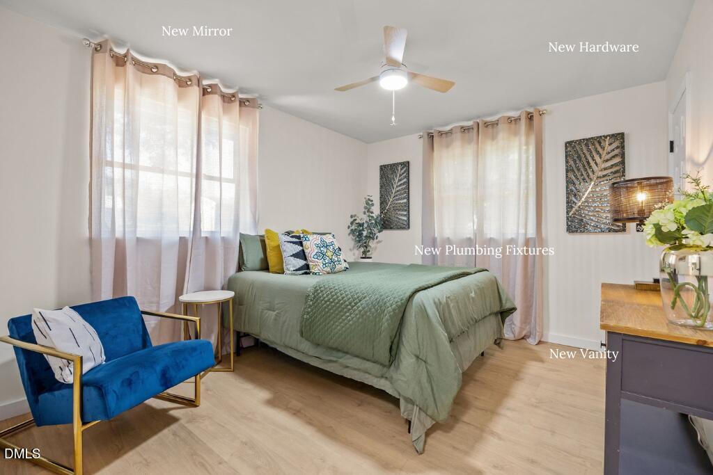 851 Hadley Road Raleigh, NC 27610 - Photo 32 of 46 a bedroom with a bed a couch and dresser