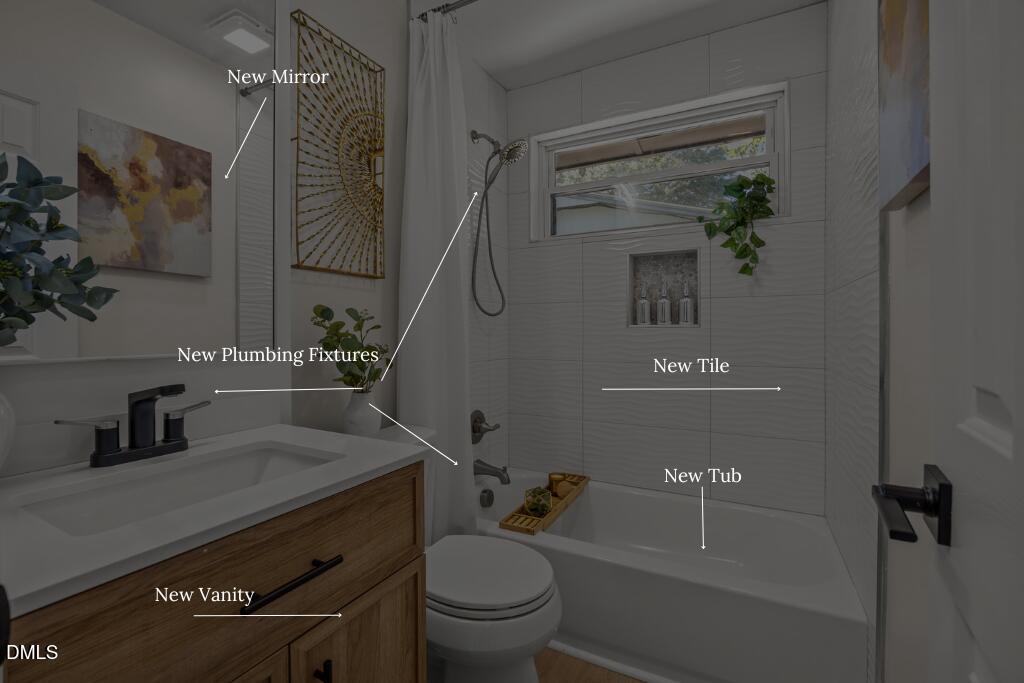 851 Hadley Road Raleigh, NC 27610 - Photo 35 of 46 a bathroom with a sink a toilet and shower