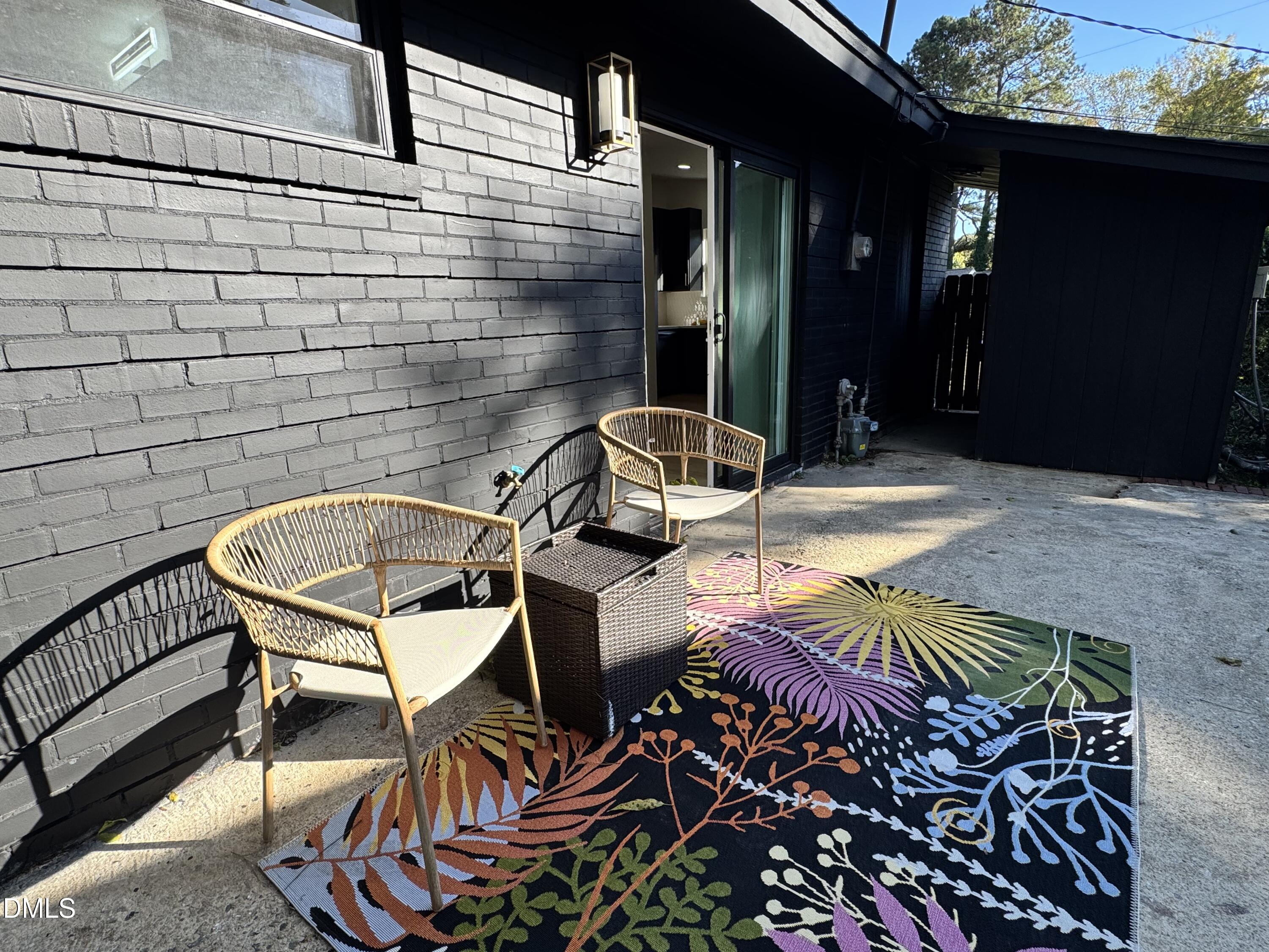 851 Hadley Road Raleigh, NC 27610 - Photo 38 of 46 a view of a chairs and table in the patio