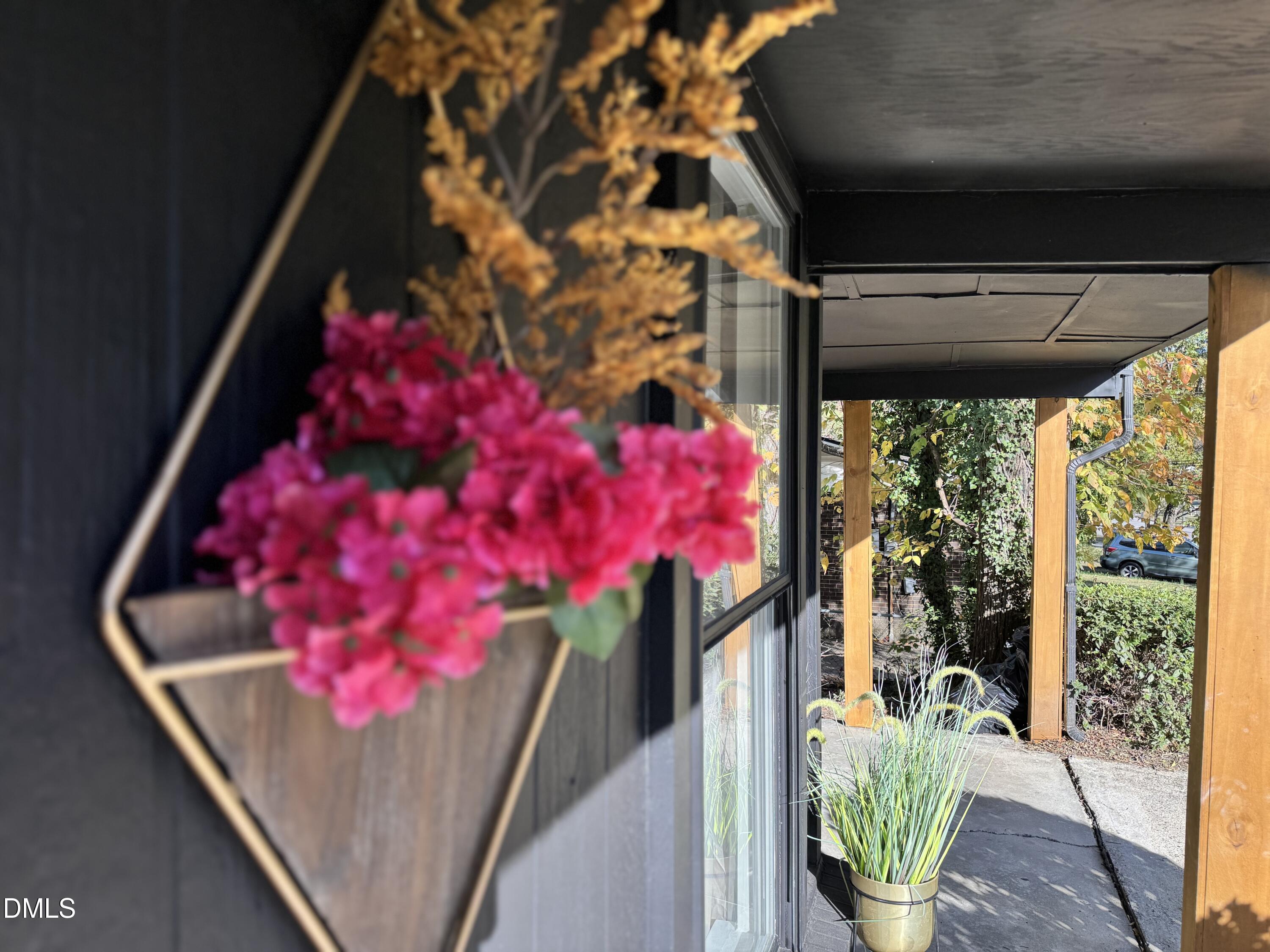 851 Hadley Road Raleigh, NC 27610 - Photo 6 of 46 a front view of a house with a potted plant