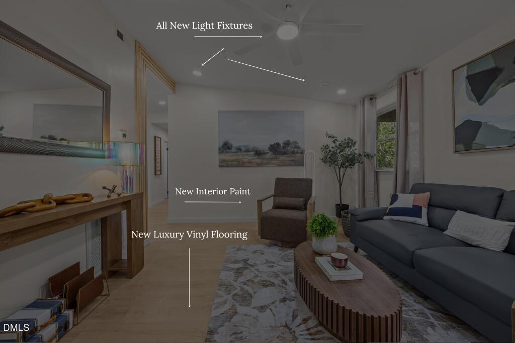 851 Hadley Road Raleigh, NC 27610 - Photo 8 of 46 a living room with furniture a rug and white walls