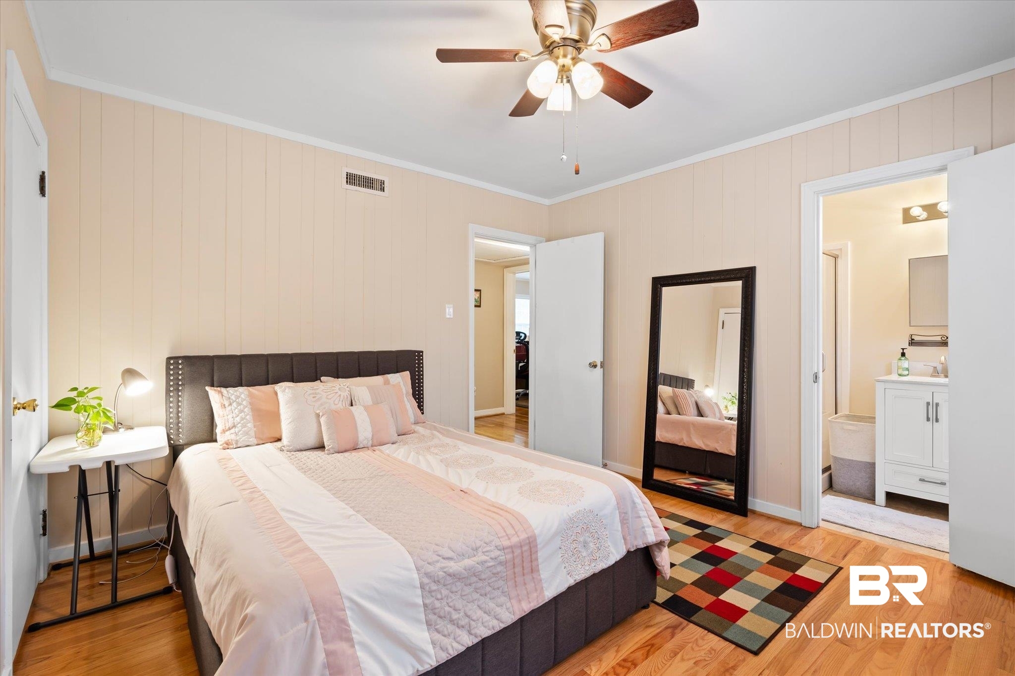 162 Bit And Spur Terrace Mobile, AL 36608 - Photo 12 of 29 Bedroom featuring light hardwood / wood-style flooring, ensuite bath, ornamental molding, sink, and ceiling fan