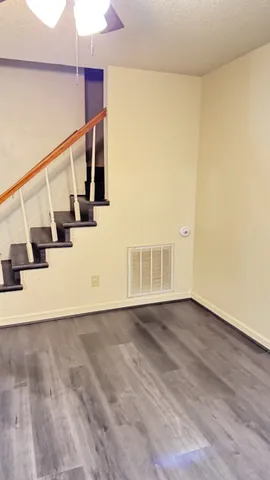 a view of an entryway with wooden floor