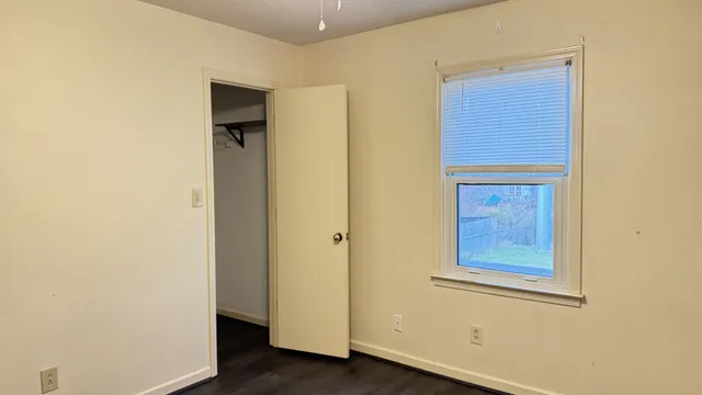 a view of front door with wooden floor