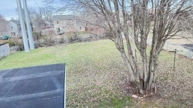 a view of a pathway with a wrought fence