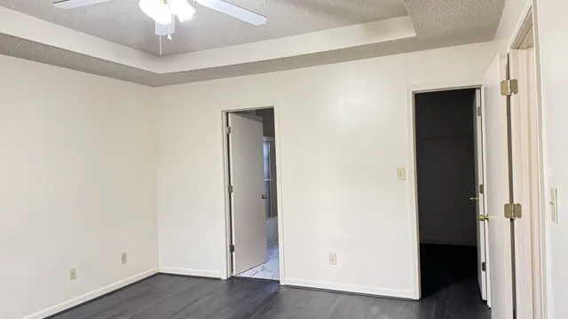 a view of a room with wooden floor
