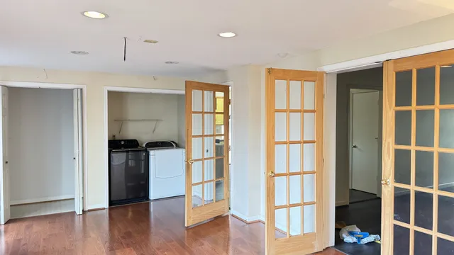 a view of entryway with wooden floor and stairs