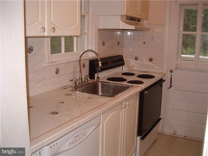 10 Valley View Road Rose Valley, PA 19063 - Photo 5 of 14 a bathroom with a sink and a mirror