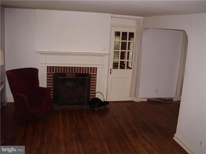 10 Valley View Road Rose Valley, PA 19063 - Photo 7 of 14 a living room with furniture and a fireplace