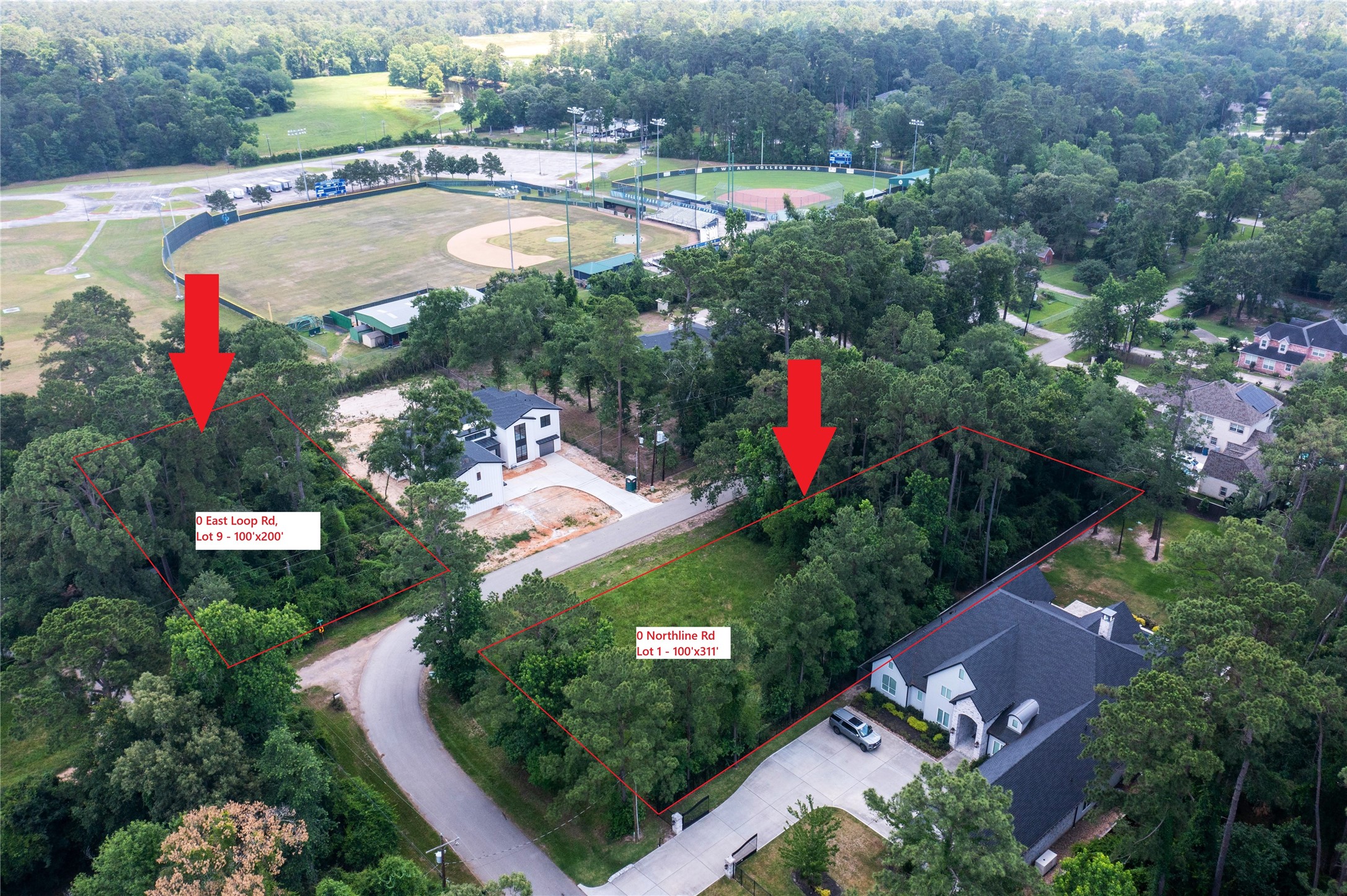 0 East Loop Road Conroe, TX 77384 - Photo 3 of 10 an aerial view of a house with a yard and lake view