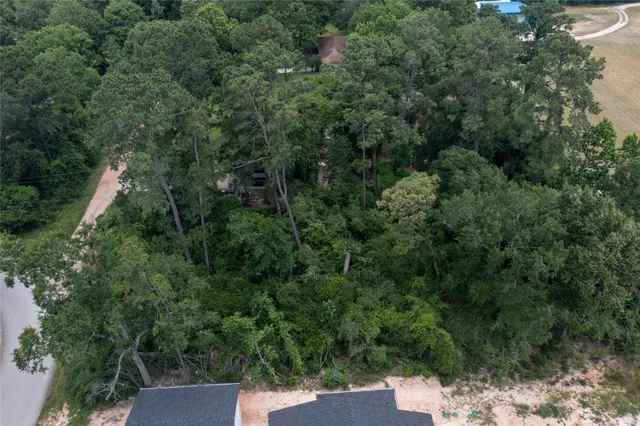 an outdoor view of house with green space