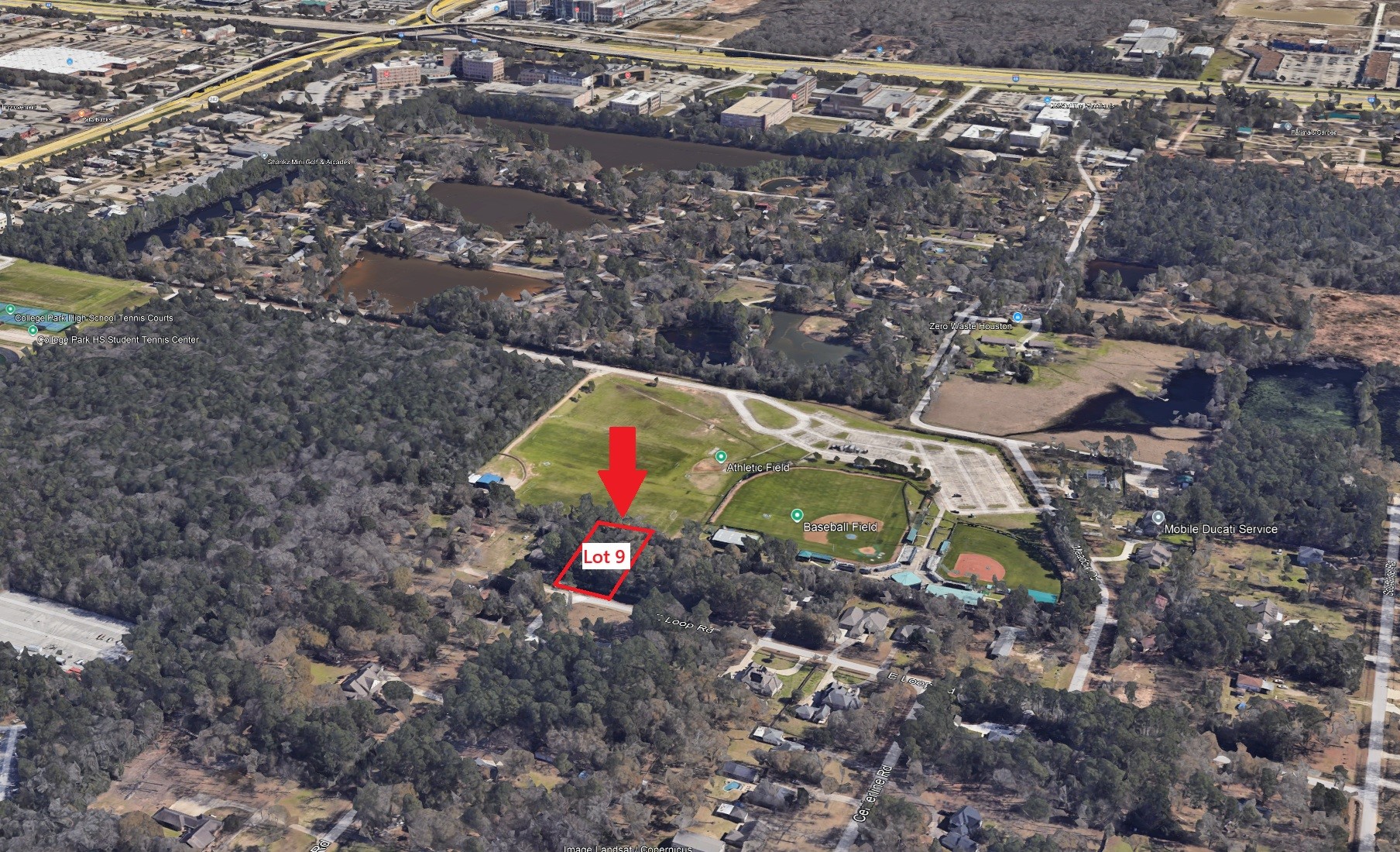 0 East Loop Road Conroe, TX 77384 - Photo 6 of 10 a view of outdoor space with truck parked