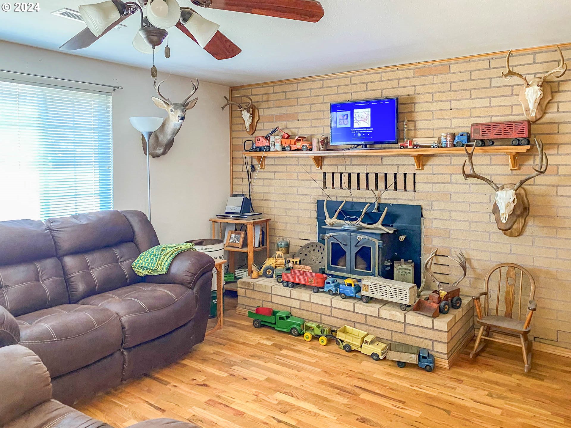 881 Northeast Newton Creek Road Roseburg, OR 97470 - Photo 2 of 11 a living room with furniture and a fireplace