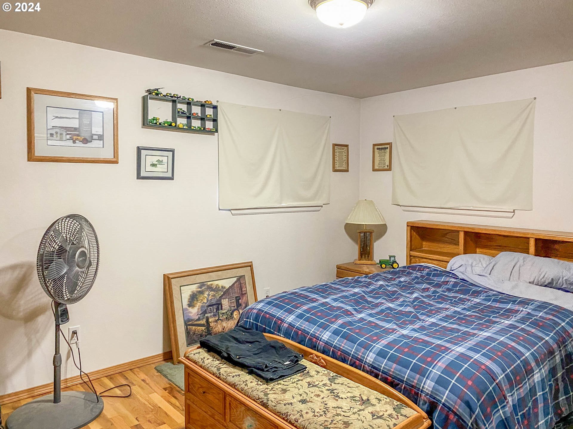 881 Northeast Newton Creek Road Roseburg, OR 97470 - Photo 6 of 11 a bedroom with a bed and a chandelier