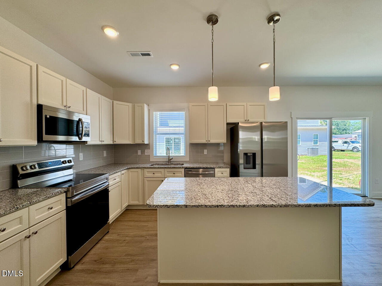 218 George Street, Unit A Four Oaks, NC 27524 - Photo 7 of 28 Kitchen + Dining Room Connection
